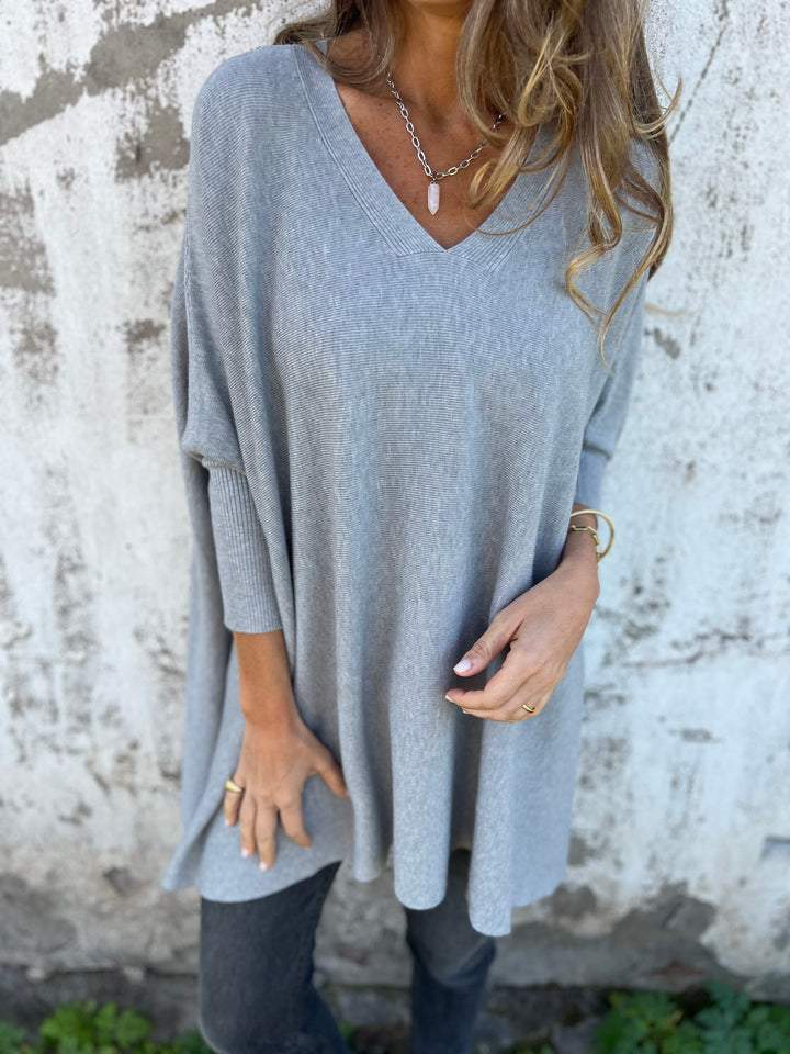 Soft, comfortable women's V-neck tunic pullover. Effortless swing style long sleeve sweater for casual fashion.