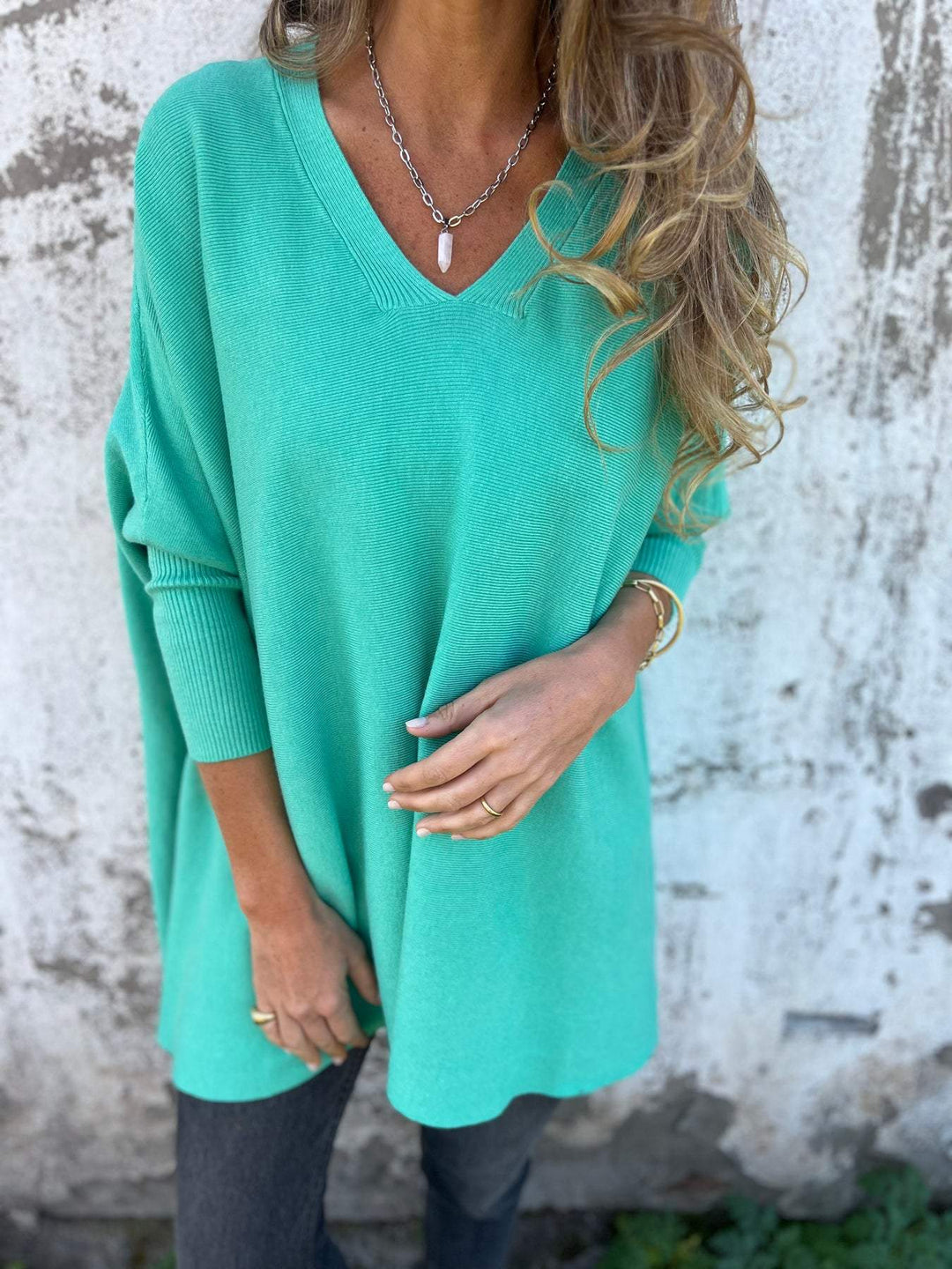 Effortless women's V-neck swing tunic pullover. Relaxed fit, long sleeve casual sweater, perfect for comfort.