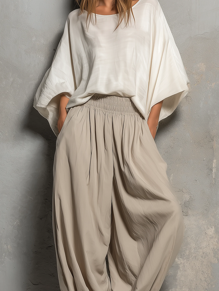 Comfortable taupe wide leg harem pants for women, featuring a drawstring waist, great for travel & casual spring wear.