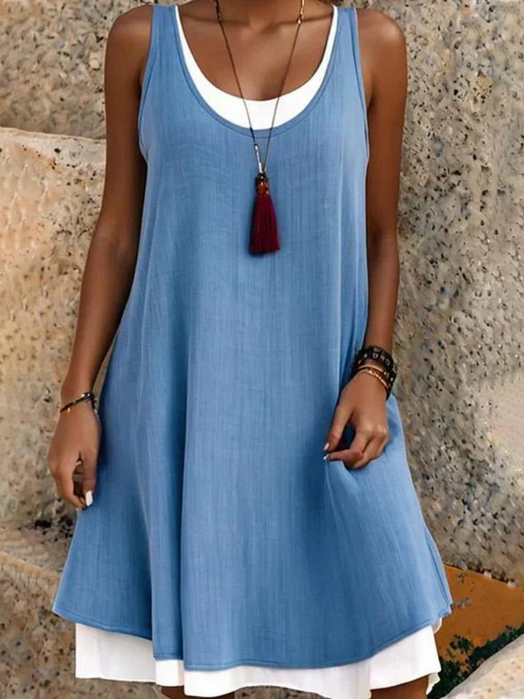 Stylish women's sleeveless midi dress with a unique two-layer design and scoop neck, ideal for versatile everyday fashion.