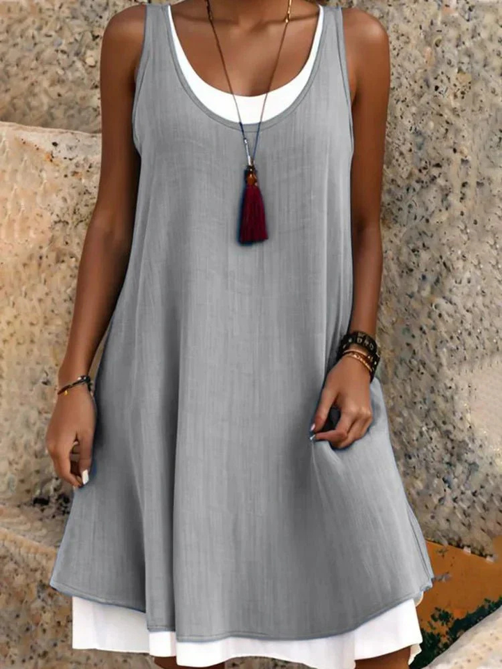 Comfortable women's A-line scoop neck summer dress, featuring an effortless two-layer design for a chic casual look.