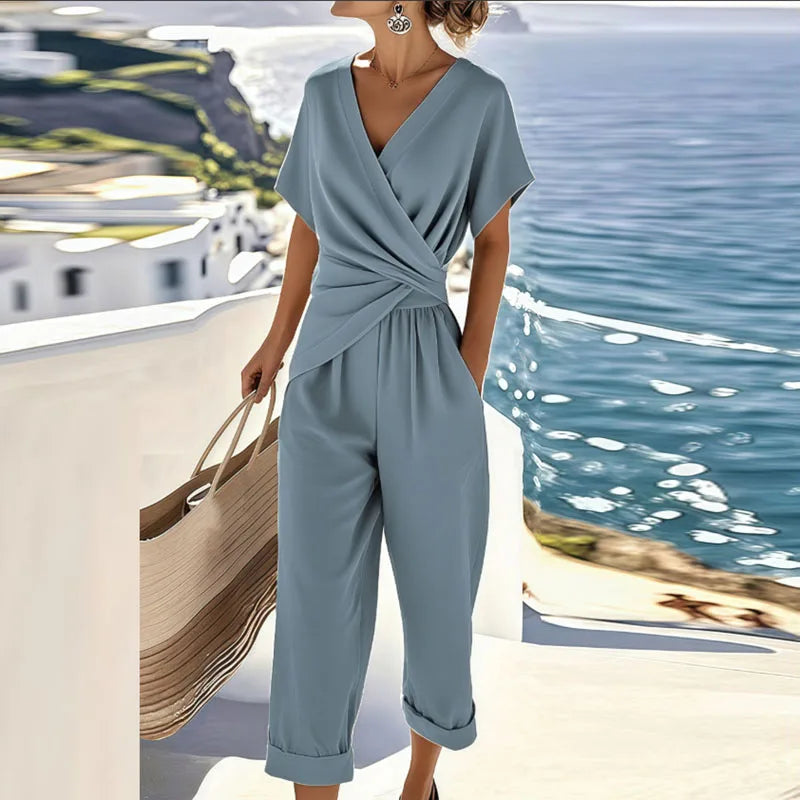 Chic women's two-piece set: comfortable wrap top & high-waisted cropped pants. Perfect for casual spring/summer style.