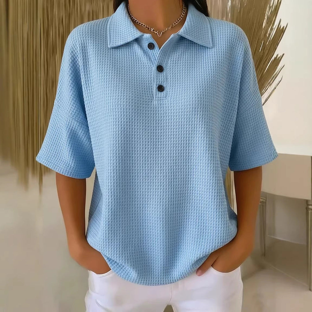 Stylish women's waffle knit short sleeve polo blouse featuring a button neck and comfortable loose fit.