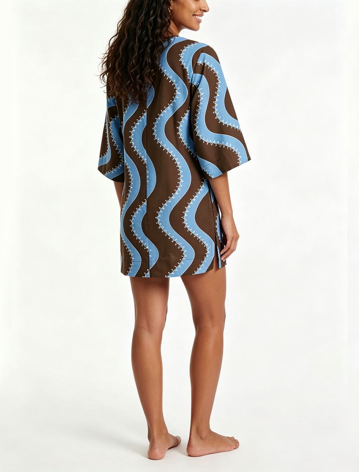 Breezy women's collared shift mini dress featuring a unique wave print, great for warm weather.
