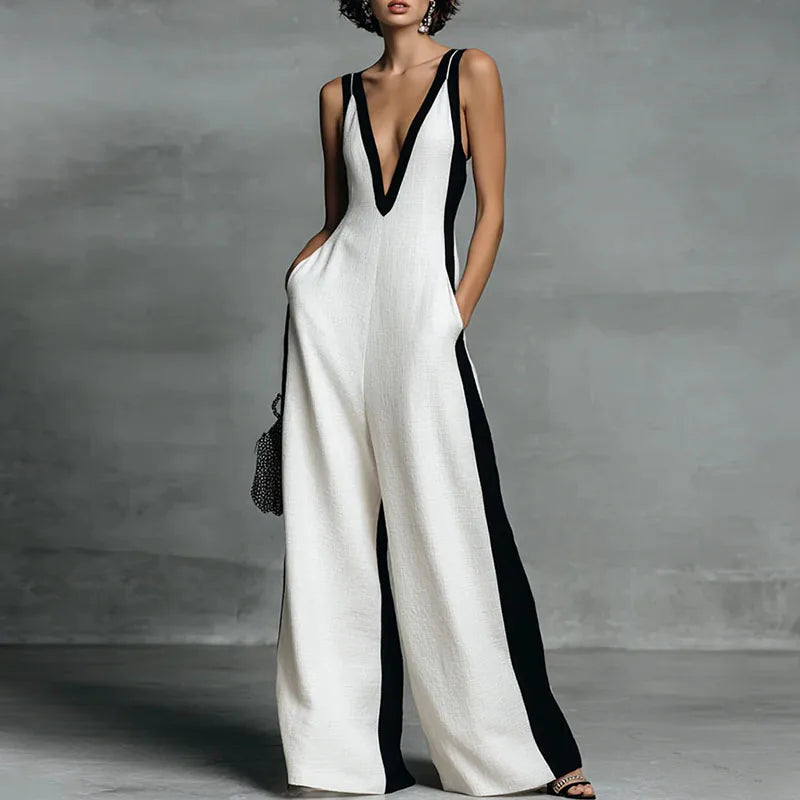 Women's effortless wide leg jumpsuit with a chic V-neck, perfect for a comfortable yet elegant summer outfit.