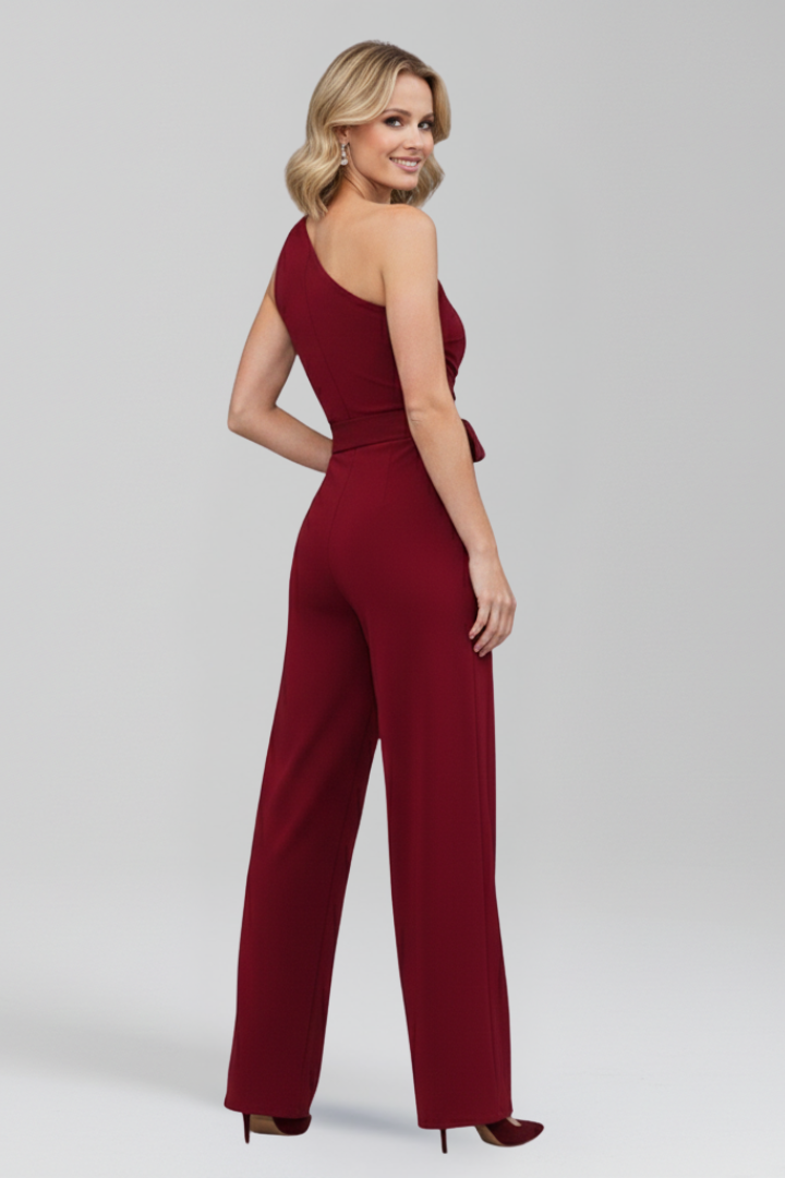 Summer style women's sleeveless jumpsuit, asymmetric neck, wide leg, and flattering waist belt.