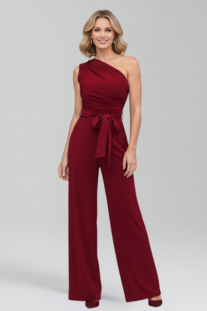 Women's asymmetric neckline wide leg jumpsuit with a matching fabric waist belt.