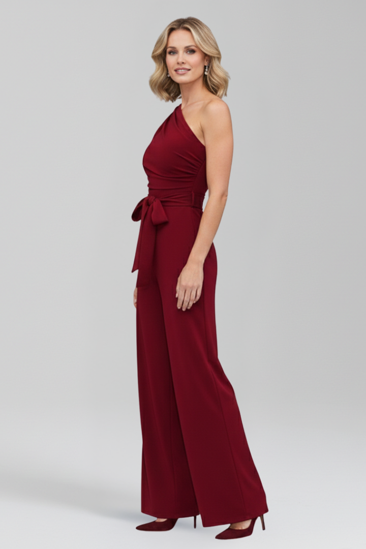 Stylish women's jumpsuit, asymmetric sleeveless top, wide leg silhouette, and an elegant waist belt.