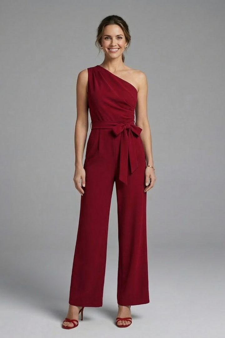 Partywear women's sleeveless asymmetric jumpsuit with waist belt, elegant and stylish.
