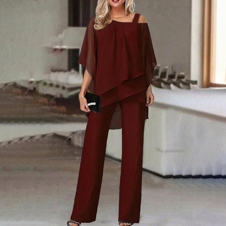Women's elegant asymmetric top and straight leg pant set in a modern style, perfect for versatile fashion.