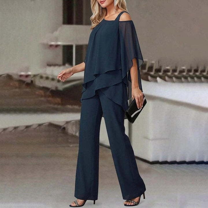 Elegant women's two-piece set with an asymmetric top & straight leg pants, offering versatile modern style.