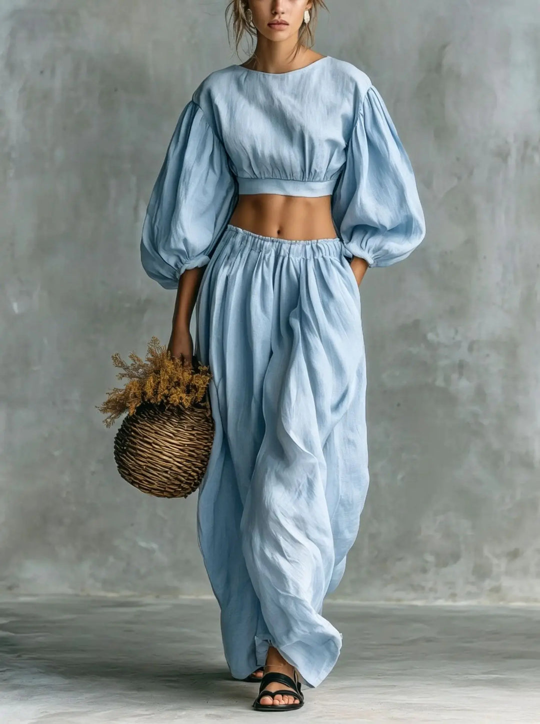 Women's elegant balloon sleeve top & wide-leg trouser two-piece co-ord set for summer vacation.