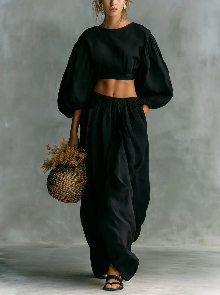 Relaxed fit women's two-piece balloon sleeve top & wide-leg trouser set, ideal for casual summer outfits.