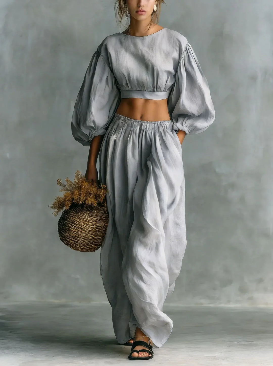 Stylish women's balloon sleeve top and wide-leg trouser set, an elegant two-piece outfit for summer vacations.