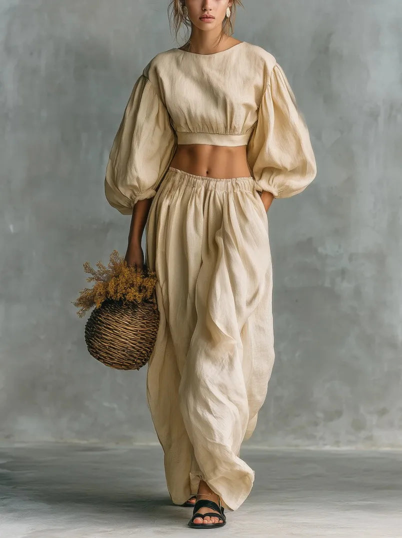 Chic women's two-piece balloon sleeve top & wide-leg trousers, a comfortable and stylish summer co-ord set.
