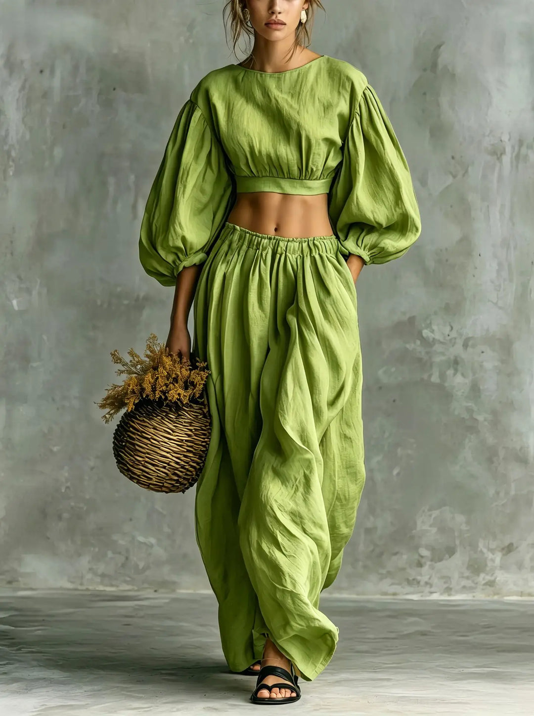 Women's elegant balloon sleeve top with wide-leg trousers. Relaxed fit two-piece casual outfit for summer.