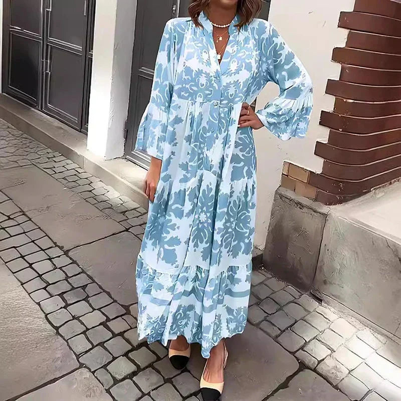 Flowy women's bohemian maxi dress featuring ornate Baroque print, lantern sleeves, and a chic button-down design.