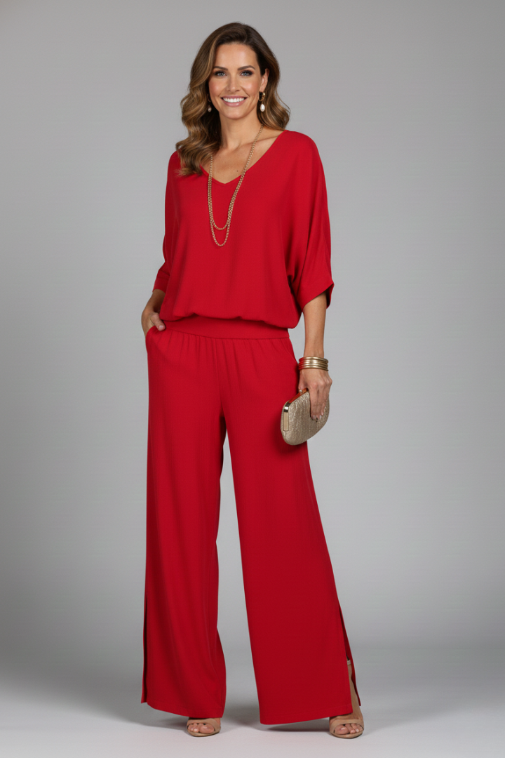 Women's two-piece elegant outfit, showcasing a stylish batwing top and comfortable wide leg trousers.