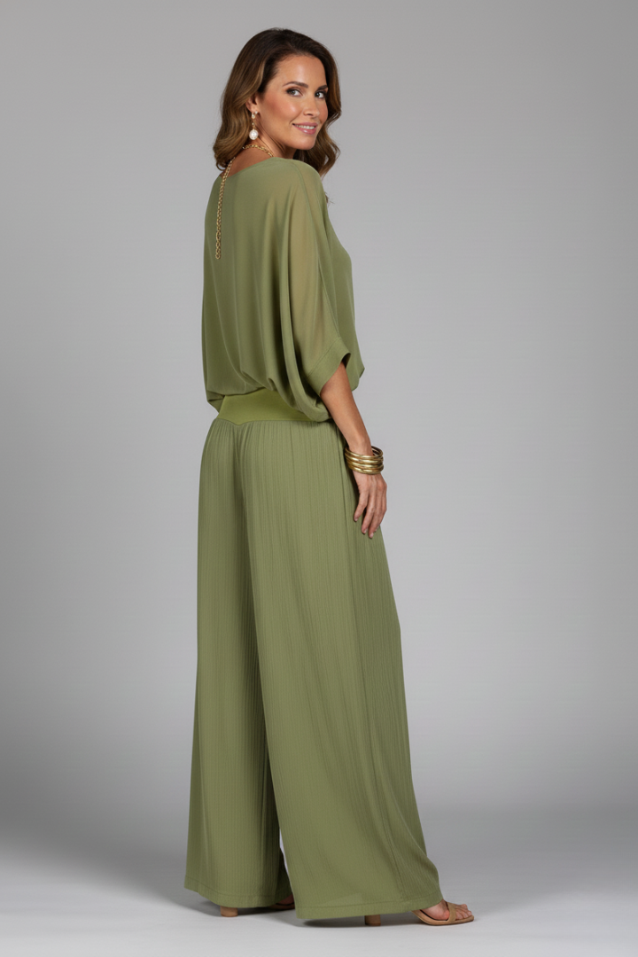 Elegant women's batwing sleeve top paired with flowing wide leg trousers, ideal for stylish summer outfits.