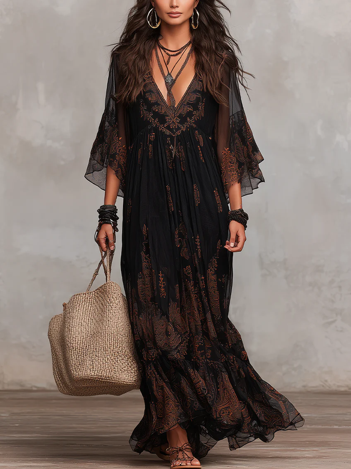 Women's elegant black boho maxi dress with flutter sleeves, V-neck, and delicate lace detail, perfect for summer parties.