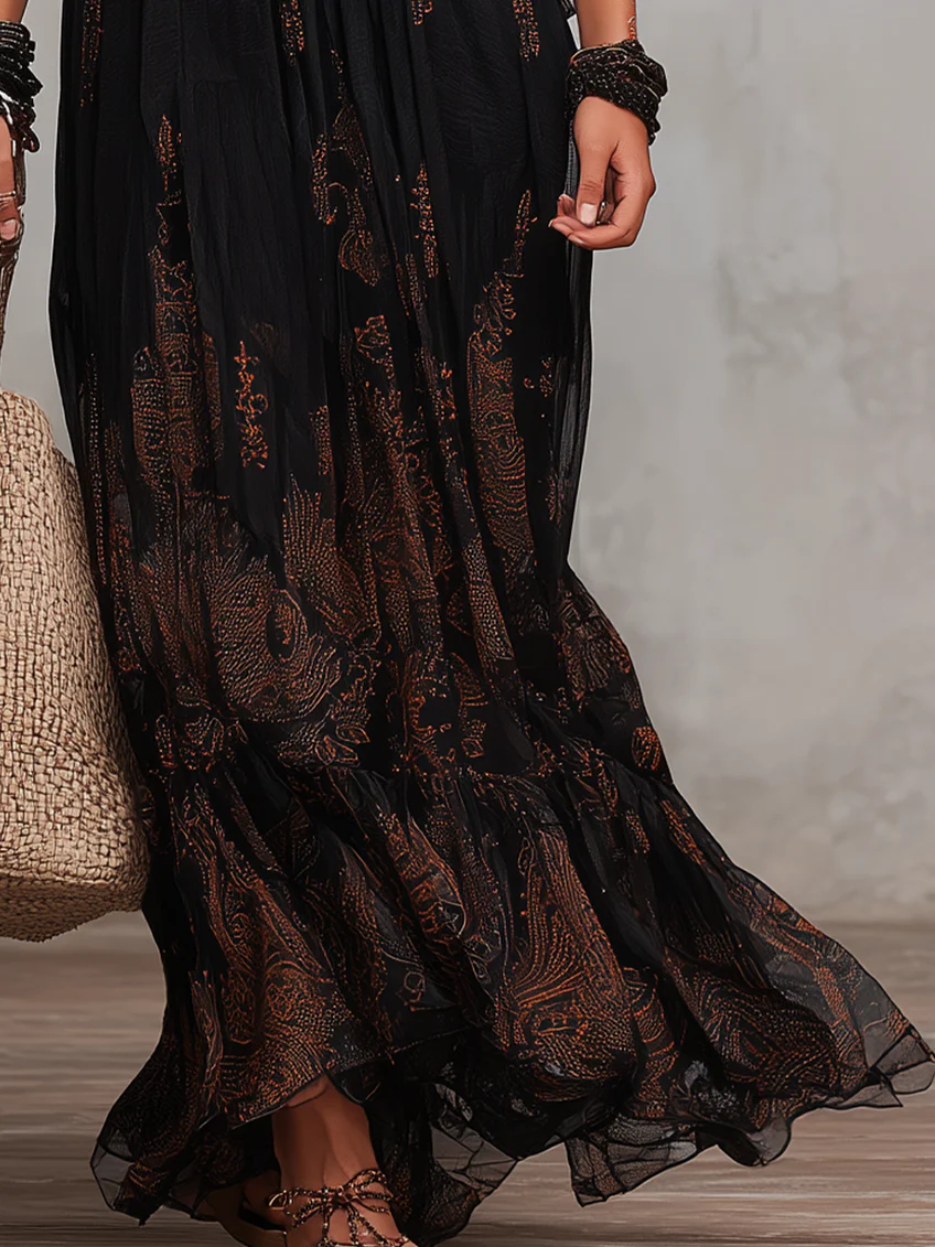 Comfortable black boho maxi dress with elegant flutter sleeves, lace trim, and tiered design, a stylish summer fashion choice.