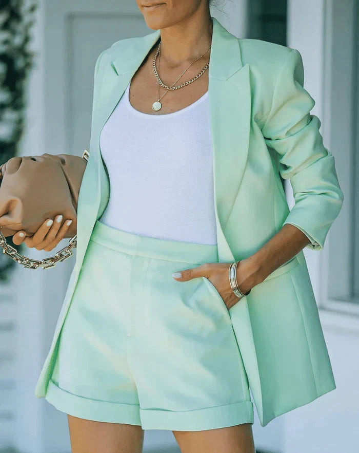 Elegant women's two-piece blazer & high-waisted shorts set. Casual chic summer style or business casual outfit.