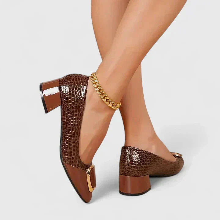 Women's elegant block heel loafers with a prominent gold buckle, perfect for professional office wear and formal attire.