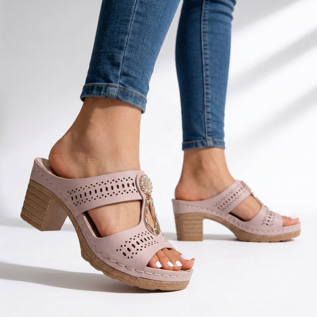 Stylish women's block heel vacation sandals with an eye-catching rhinestone T-strap, offering elegant summer comfort.