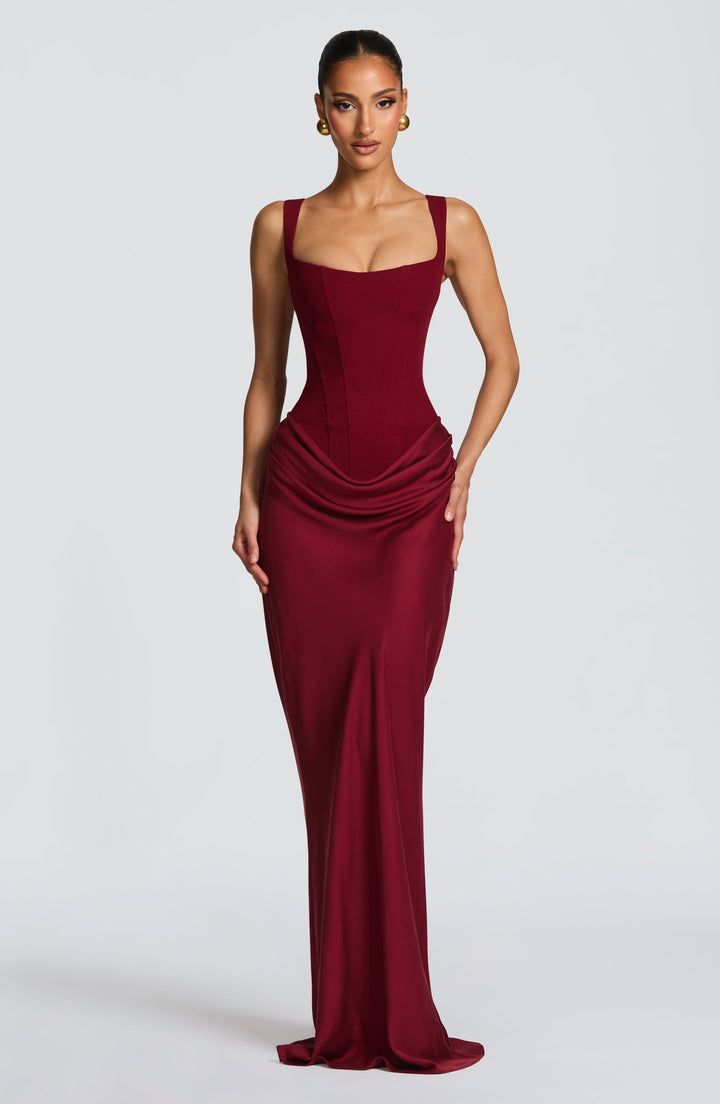Women's elegant corset bodice maxi dress with wide straps & draped skirt. Perfect for formal events.