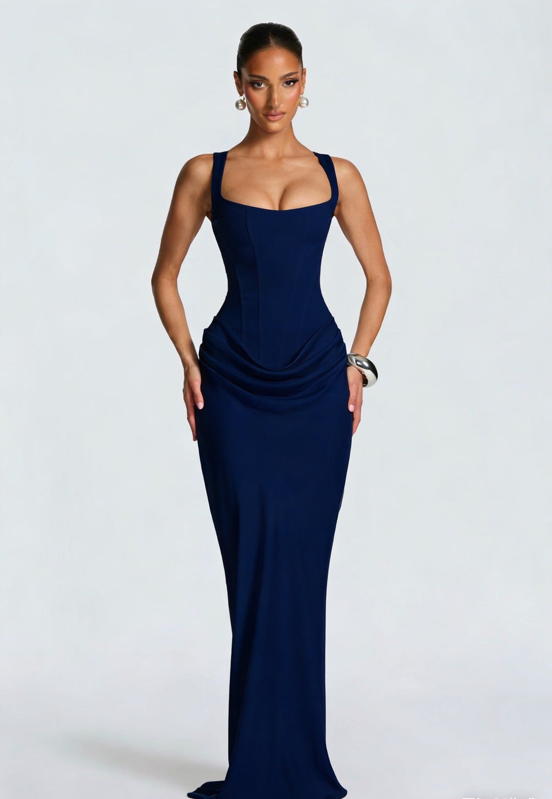 Women's formal maxi dress with structured corset bodice, wide straps, and flowing long skirt. Party perfect.