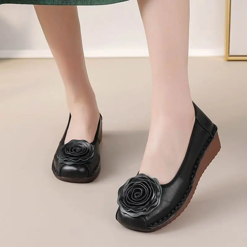 Chic women's flat footwear: floral appliqué slip-on loafers for ultimate comfort.