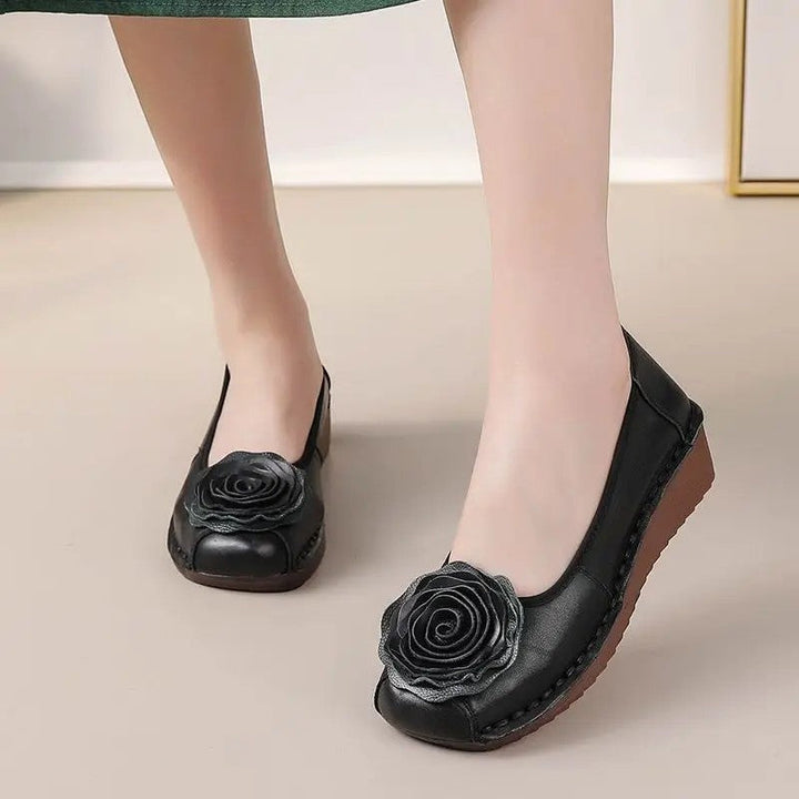 Chic women's flat footwear: floral appliqué slip-on loafers for ultimate comfort.