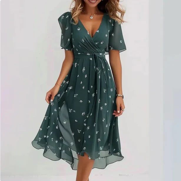 Feminine women's floral print wrap midi dress, featuring puff sleeves & a flowy silhouette for summer vacation.