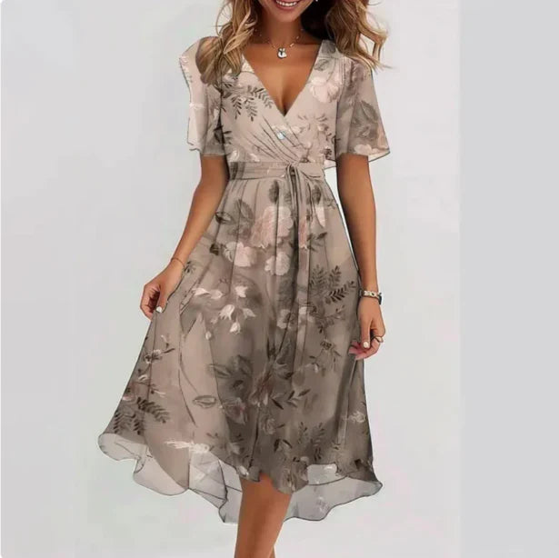 Elegant women's summer wrap dress with vibrant floral print, flowy skirt, and puff sleeves for any occasion.