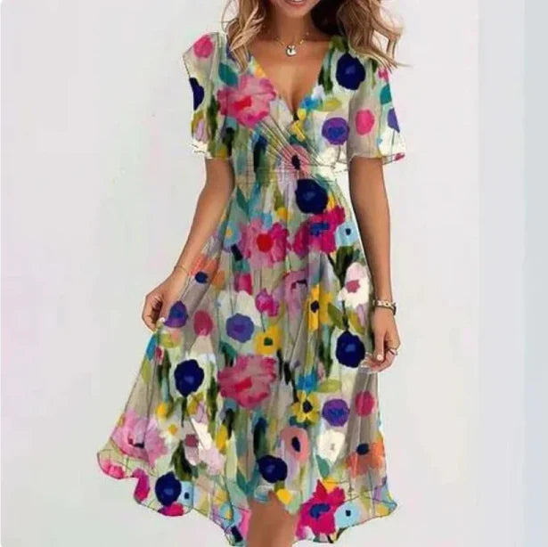 Full length view of women's flowy floral wrap midi dress, an elegant A-line summer dress for vacations & parties.