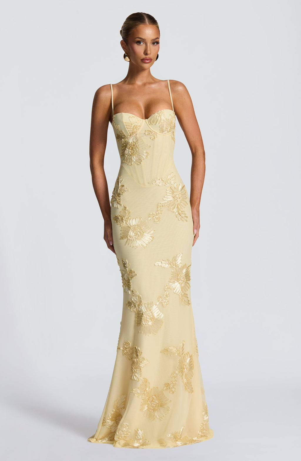 Women's elegant floral maxi dress with corset bodice, spaghetti straps, and a-line skirt, perfect for wedding guests.
