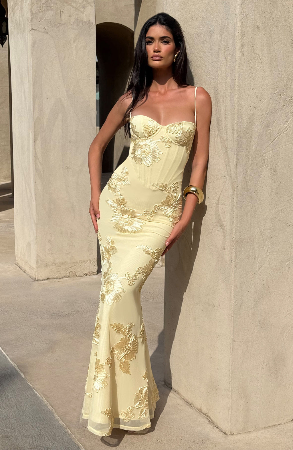Flattering women's floral corset maxi dress, with elegant spaghetti straps and a flowing skirt, perfect for wedding guests.