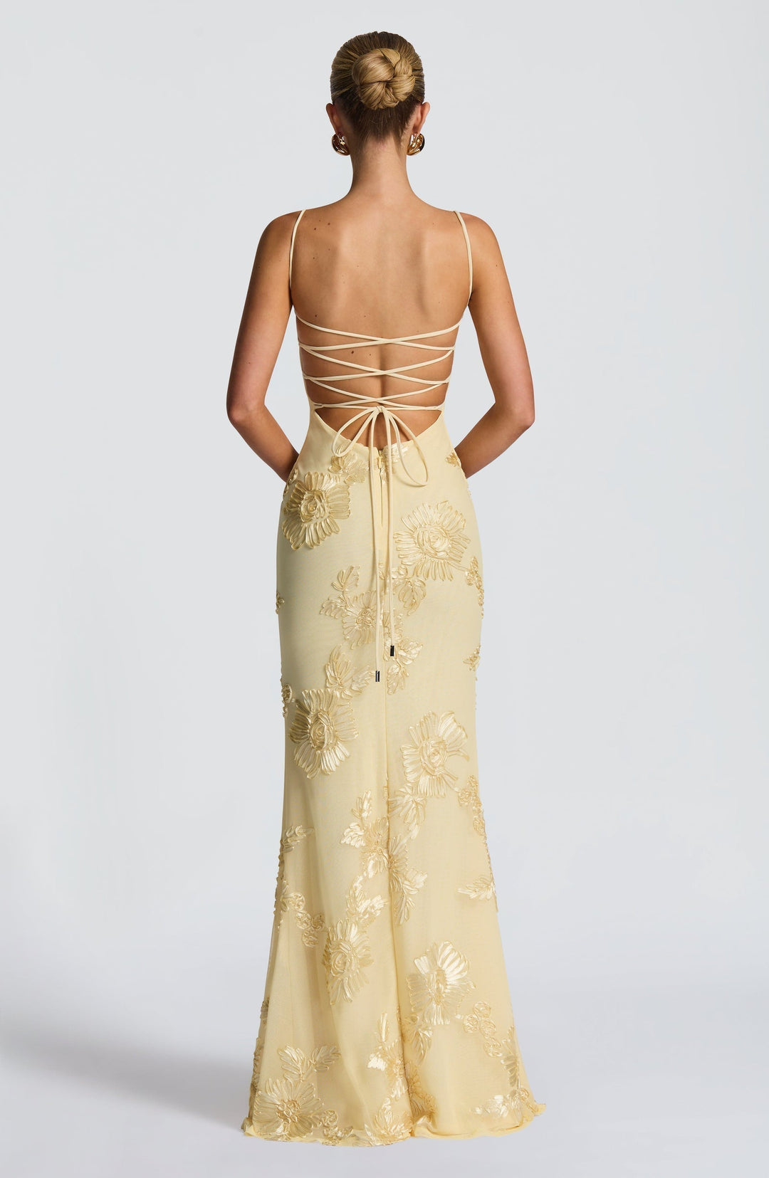 Elegant A-line floral maxi dress for women, featuring a flattering corset, spaghetti straps & a low back, for formal events.