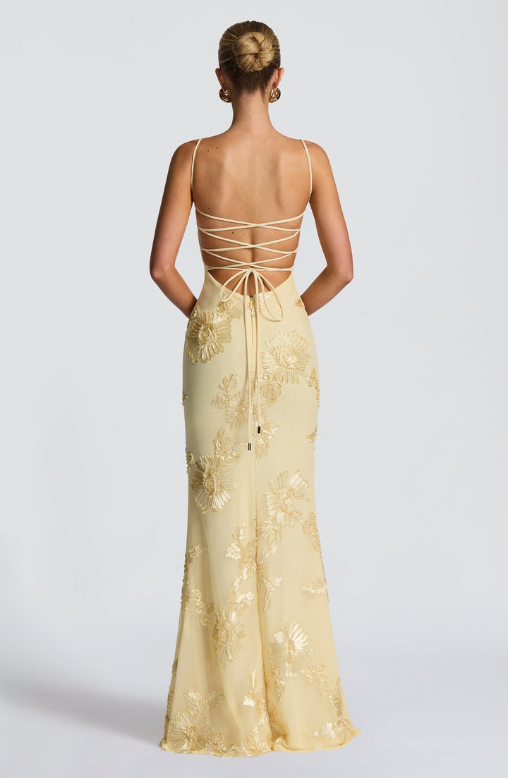 Elegant A-line floral maxi dress for women, featuring a flattering corset, spaghetti straps & a low back, for formal events.