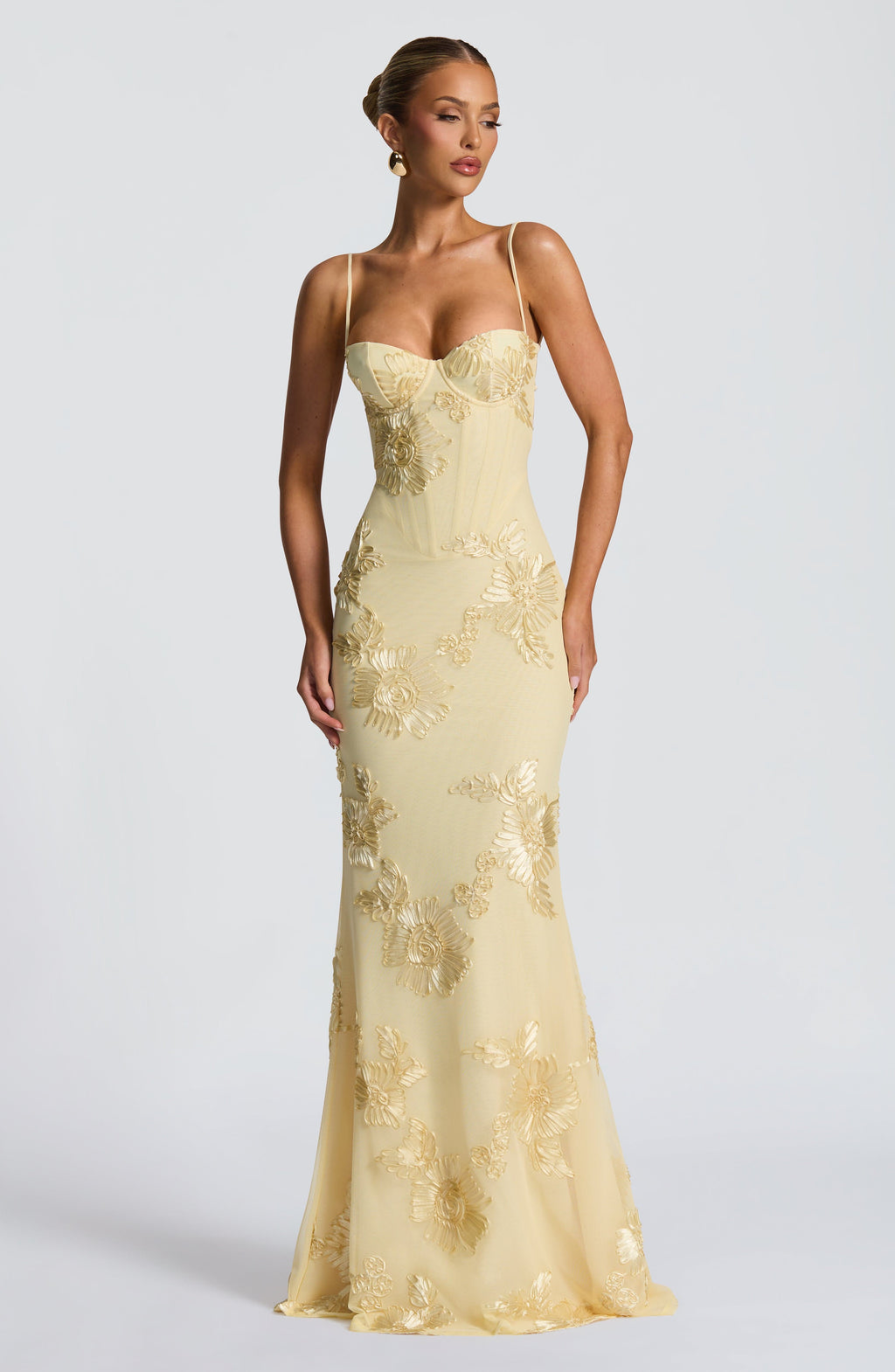 Stunning women's floral maxi dress with a fitted corset, flowy a-line skirt & spaghetti straps, perfect for special occasions.