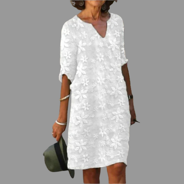 Versatile women's floral midi dress, elegant V-neck and half sleeves, ideal for casual wear or special occasions.