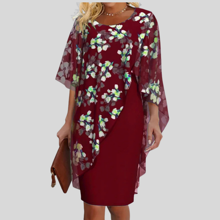 Feminine women's floral summer dress with flowy A-line cut, ideal for elegant spring & summer fashion.