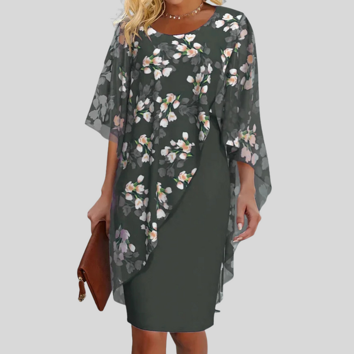Sleeveless women's party dress featuring an elegant floral print & flowy A-line design for special occasions.