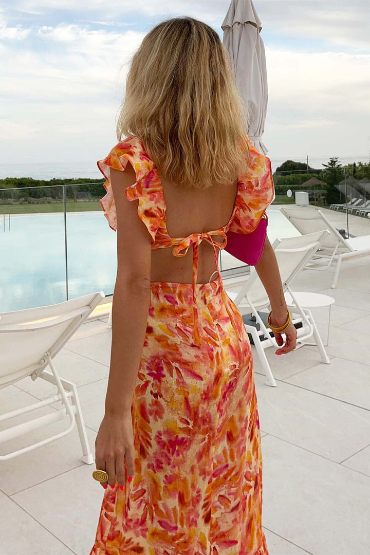 Close-up of the delicate floral pattern on a women's ruffle maxi dress, ideal for spring events.