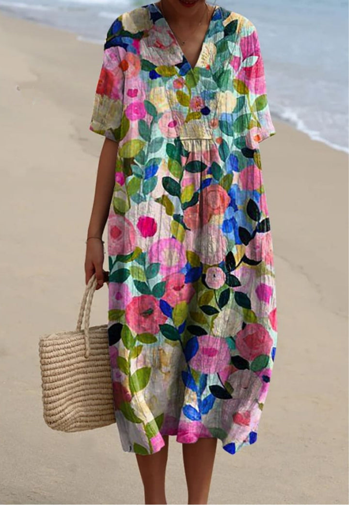 Women's elegant floral V-neck short sleeve oversized midi dress for casual summer wear or vacation. Comfortable and stylish.