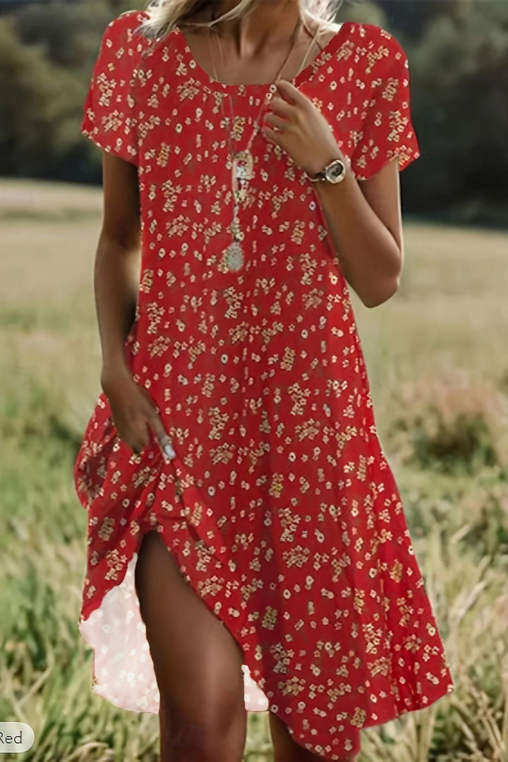 Graceful women's flowing midi dress with an elegant silhouette, perfect for a refined and stylish look.