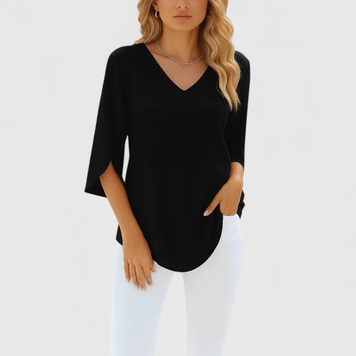 Women's elegant flowy blouse with relaxed fit, perfect for office or casual chic style. Versatile fashion top.