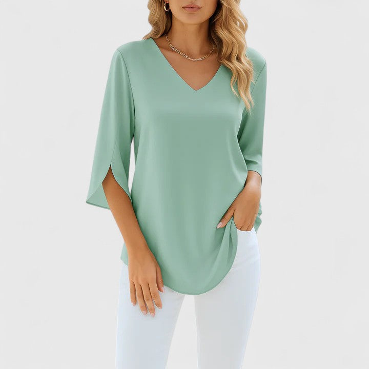 Women's elegant flowy blouse. Versatile split sleeve top for effortless office & casual feminine fashion.