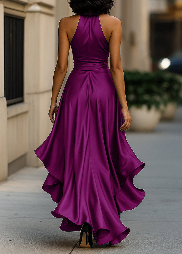 Sophisticated women's wedding guest gown, with an elegant halter neck and a flowing asymmetric ruffle.