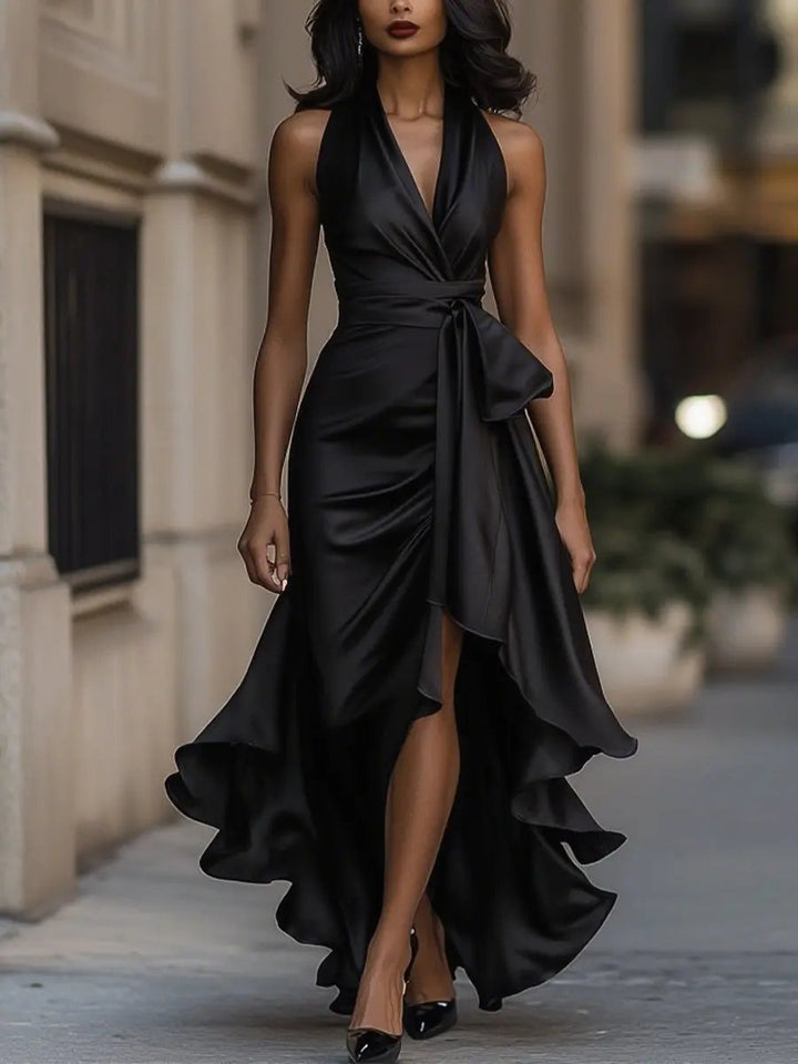 Feminine women's halter neck maxi evening dress with a flattering wrap waist. Elegant and long.